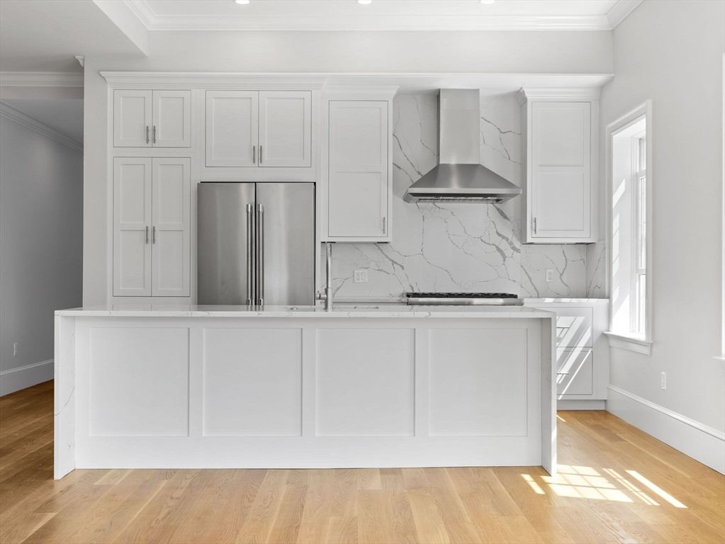 Interior, Kitchen, Marble Walls, Recessed Lighting, Stainless Steel Appliances, Wood Texture Flooring