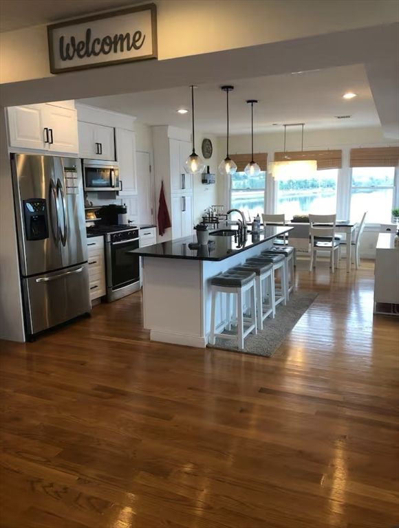Dining room, Interior, Kitchen, Pendant Lights, Recessed Lighting, Stainless Steel Appliances, Wood Texture Flooring