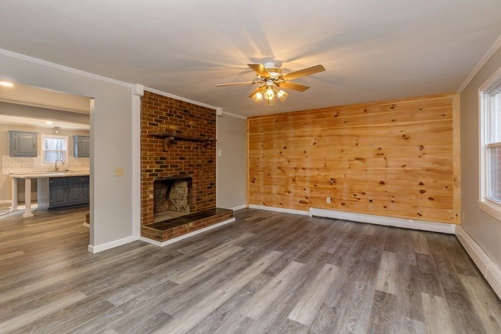 Empty room, Fireplace, Interior, Kitchen, Recessed Lighting, Stone Walls, Wood Texture Flooring, Wooden Walls
