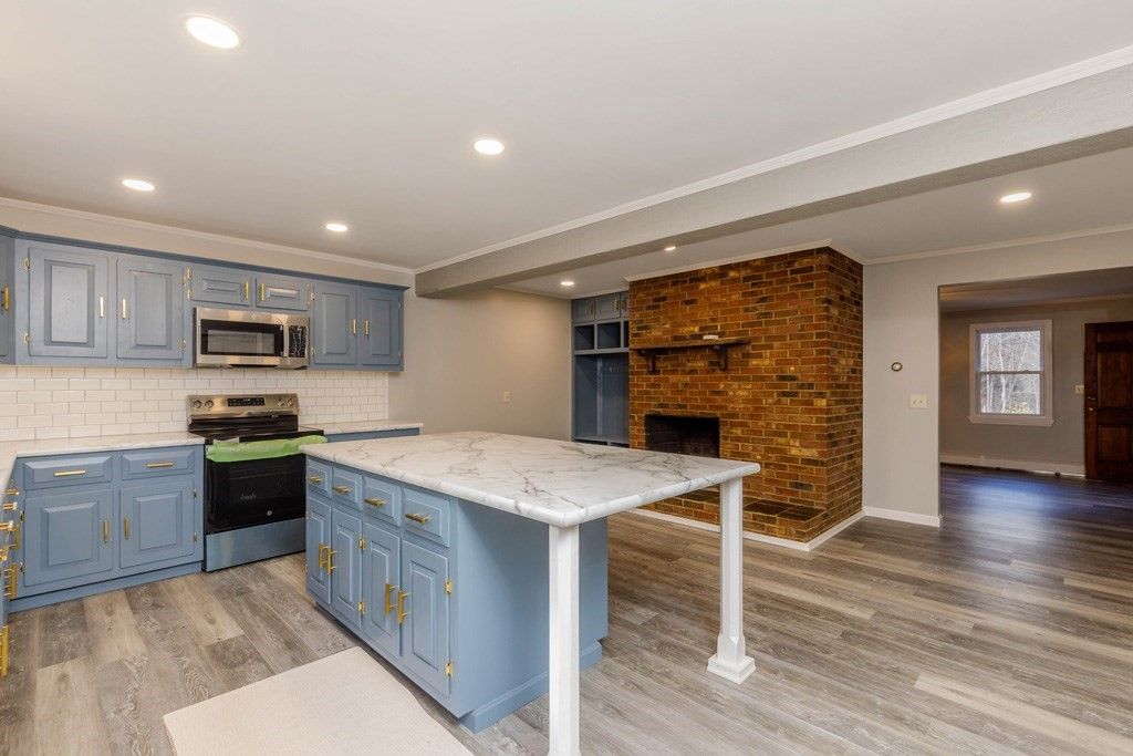 Interior, Kitchen, Recessed Lighting, Stainless Steel Appliances, Stone Walls, Wood Texture Flooring