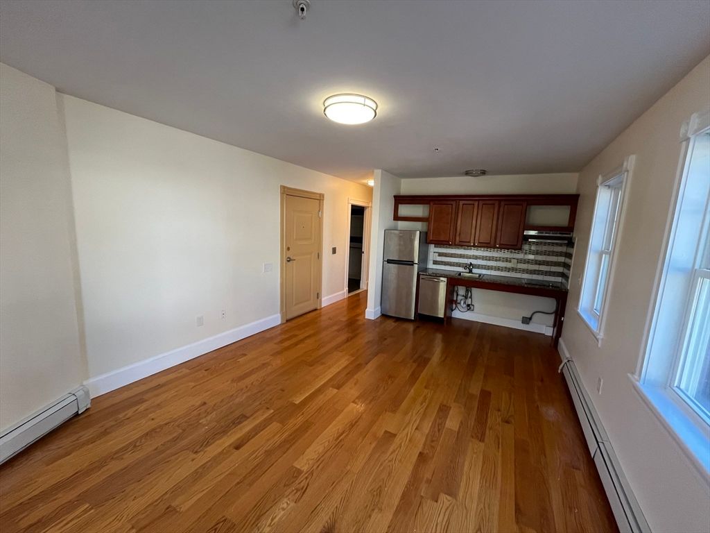 Empty room, Interior, Kitchen, Stainless Steel Appliances, Wood Texture Flooring