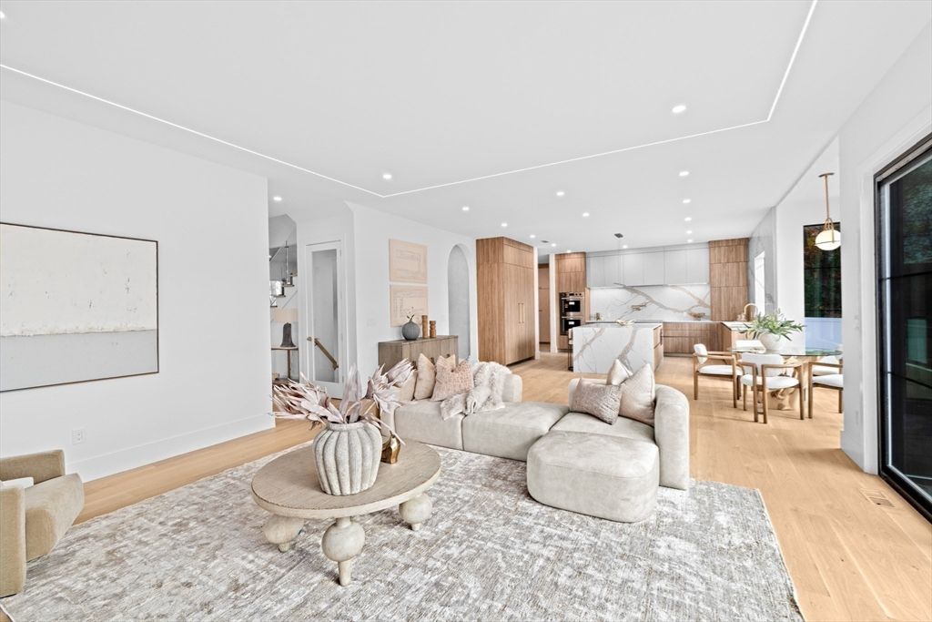 Dining room, Interior, Kitchen, Living room, Marble Walls, Pendant Lights, Recessed Lighting, Stainless Steel Appliances, Wood Texture Flooring