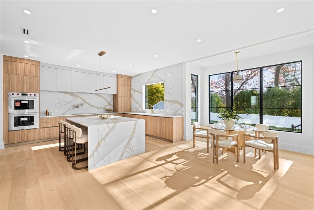 Dining room, Interior, Kitchen, Marble Walls, Pendant Lights, Recessed Lighting, Stainless Steel Appliances, Wood Texture Flooring