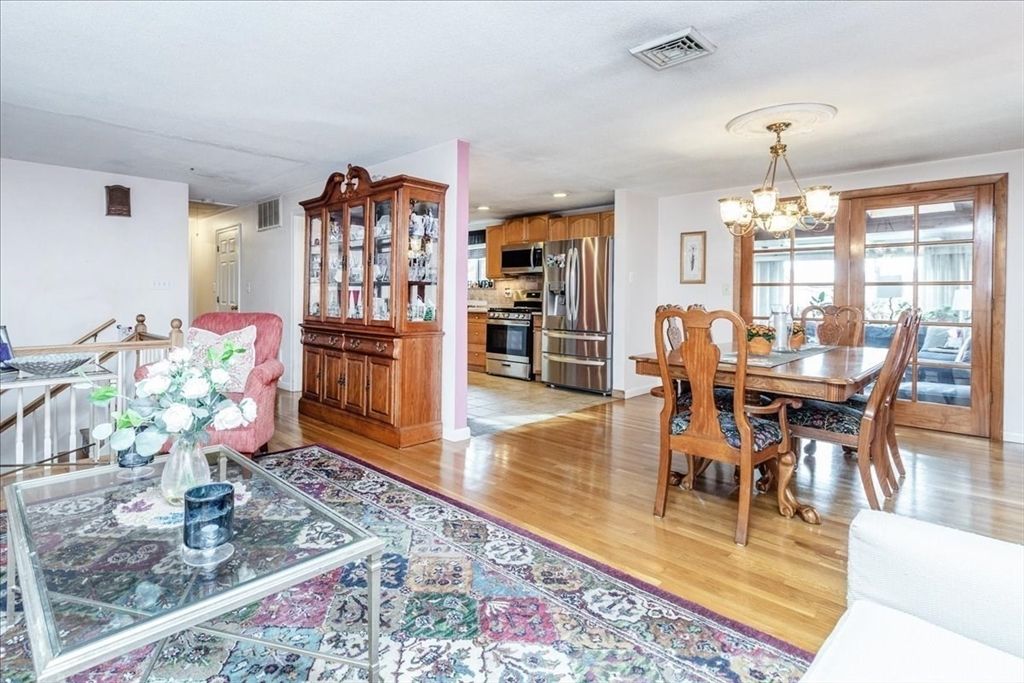 Chandelier, Dining room, Interior, Kitchen, Recessed Lighting, Stainless Steel Appliances, Wood Texture Flooring