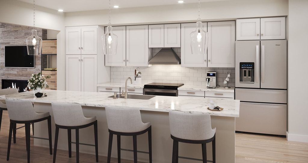 Fireplace, Interior, Kitchen, Pendant Lights, Recessed Lighting, Stainless Steel Appliances, Stone Walls, Wood Texture Flooring