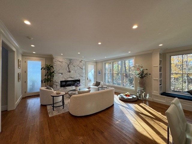 Fireplace, Interior, Living room, Marble Walls, Recessed Lighting, Wood Texture Flooring