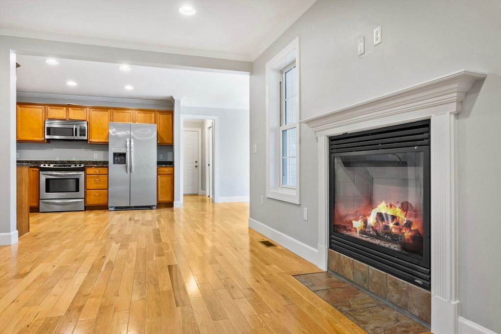Fireplace, Interior, Kitchen, Recessed Lighting, Stainless Steel Appliances, Wood Texture Flooring