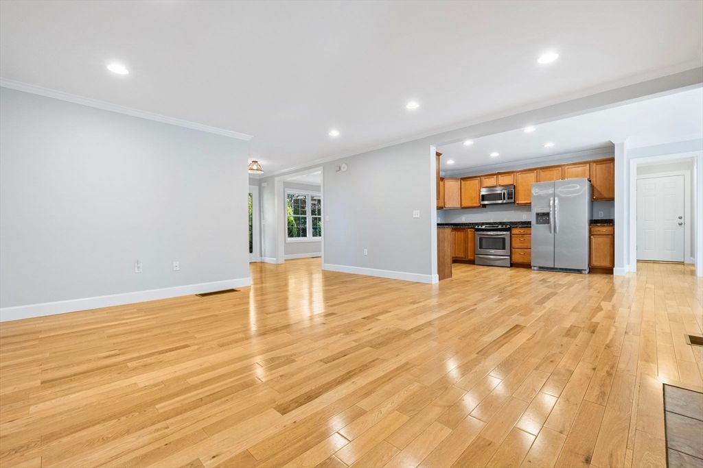 Empty room, Interior, Kitchen, Recessed Lighting, Stainless Steel Appliances, Wood Texture Flooring