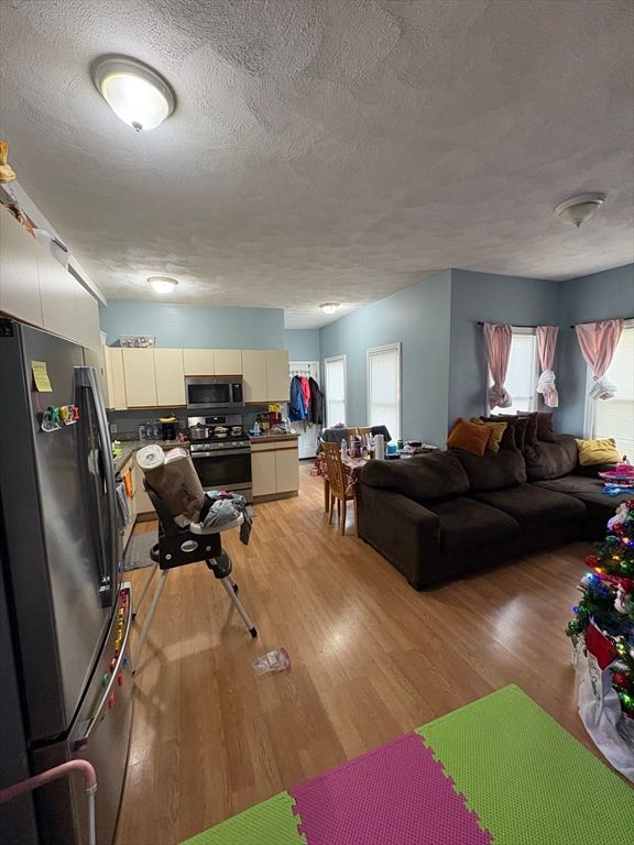 Fitness Equipment, Interior, Kitchen, Living room, Stainless Steel Appliances, Wood Texture Flooring