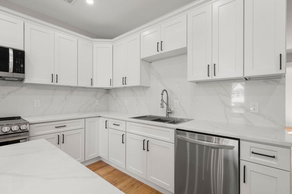 Interior, Kitchen, Marble Walls, Recessed Lighting, Stainless Steel Appliances, Wood Texture Flooring