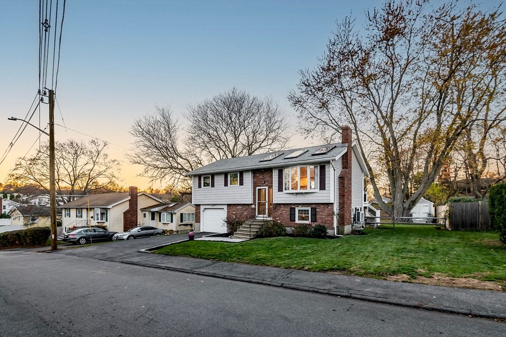 Attached, Exterior, Facade, Brick Facade, Solar Panels, Raised Ranch