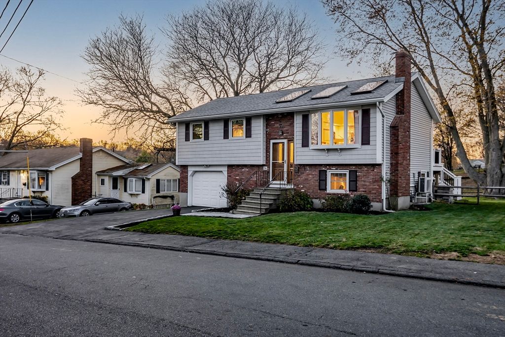 Attached, Exterior, Facade, Brick Facade, Solar Panels, Raised Ranch