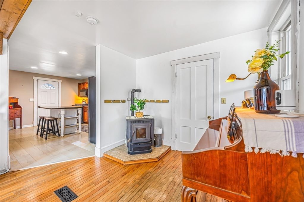 Fireplace, Interior, Piano, Recessed Lighting, Wood Texture Flooring