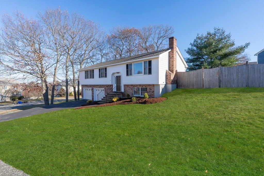 Attached, Backyard, Exterior, Facade, Brick Facade, Raised Ranch