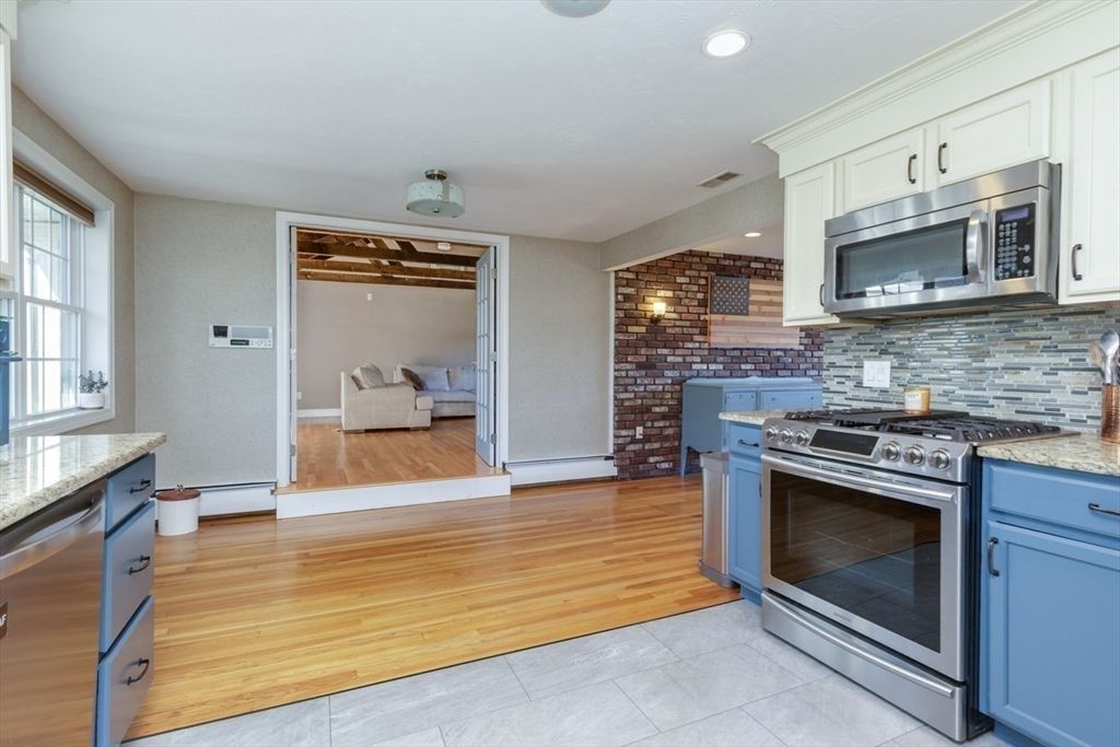 Interior, Kitchen, Recessed Lighting, Stainless Steel Appliances, Stone Walls, Wood Texture Flooring