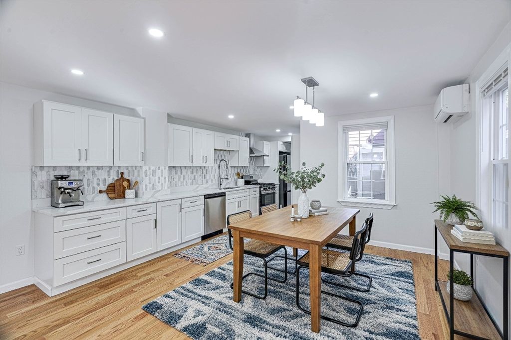 Dining room, Interior, Kitchen, Pendant Lights, Recessed Lighting, Stainless Steel Appliances, Wood Texture Flooring