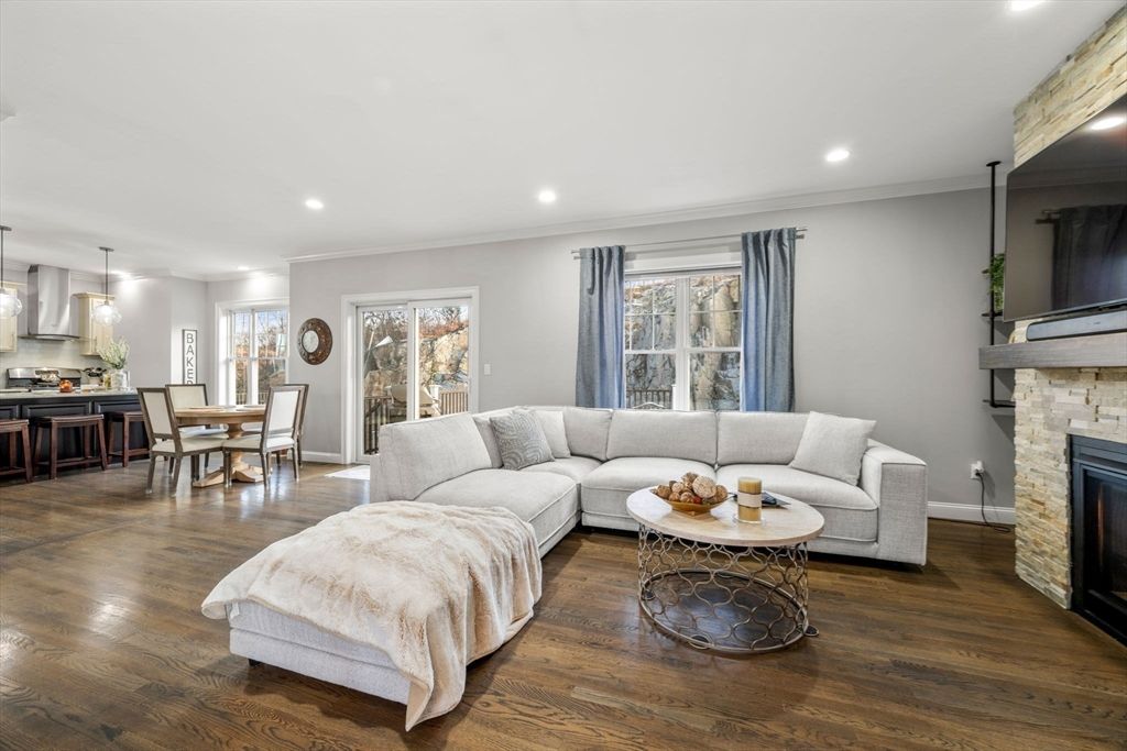 Dining room, Fireplace, Interior, Living room, Pendant Lights, Recessed Lighting, Wood Texture Flooring
