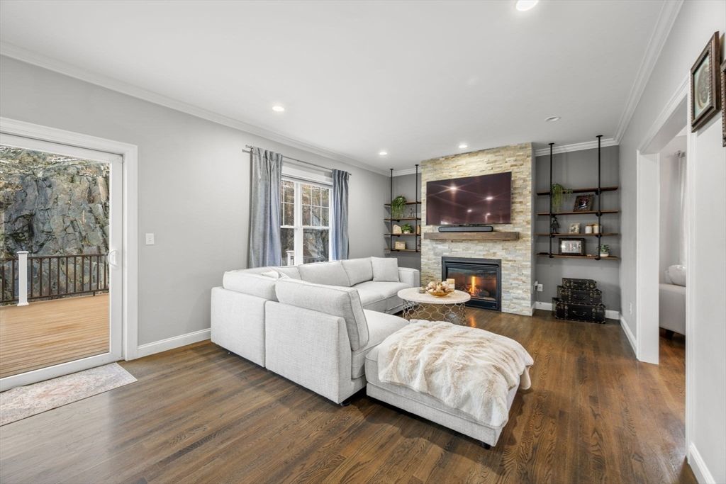 Fireplace, Interior, Living room, Recessed Lighting, Stone Walls, Wood Texture Flooring