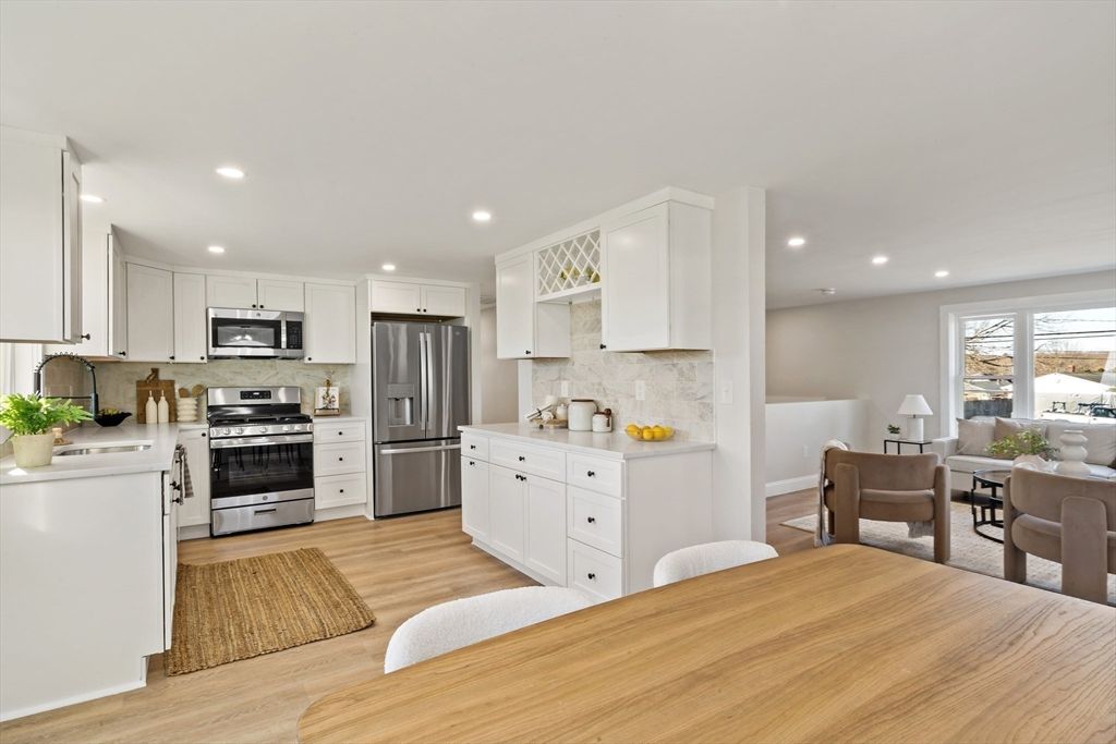 Dining room, Interior, Kitchen, Living room, Recessed Lighting, Stainless Steel Appliances, Wood Texture Flooring