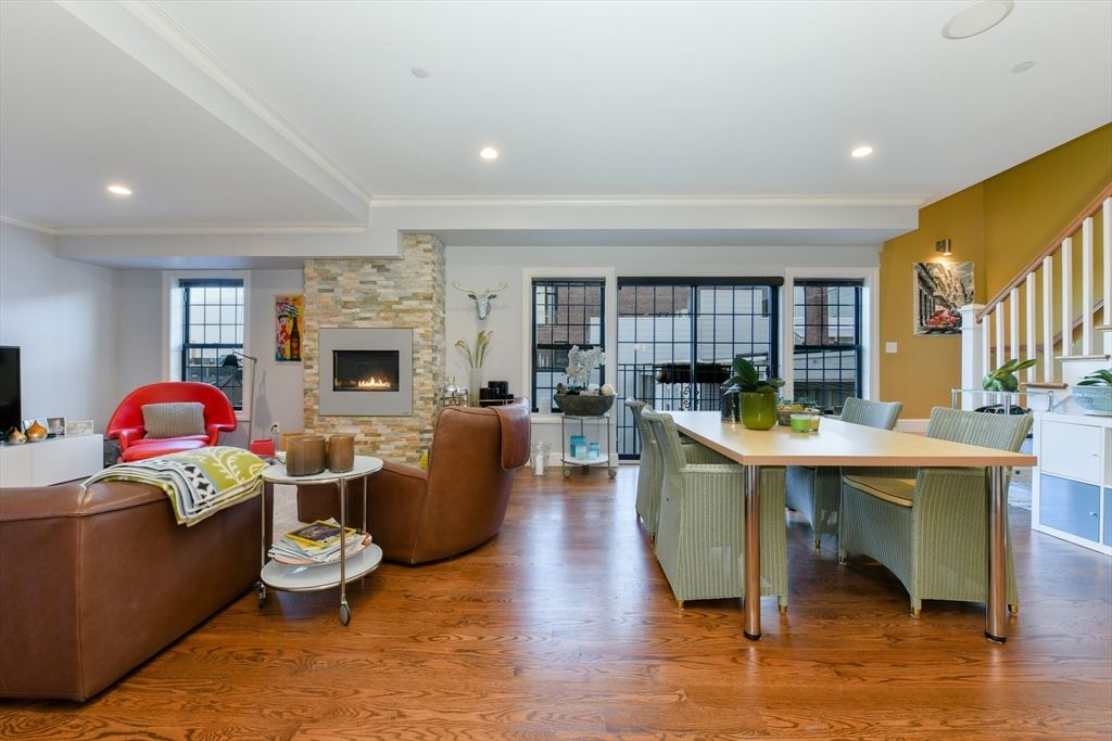 Dining room, Fireplace, Interior, Living room, Recessed Lighting, Stone Walls, Wood Texture Flooring