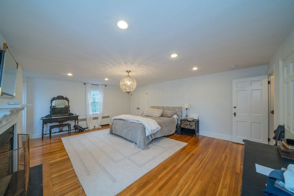 Bedroom, Chandelier, Fireplace, Interior, Piano, Recessed Lighting, Wood Texture Flooring