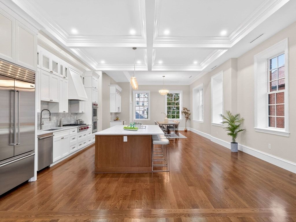 Chandelier, Dining room, Interior, Kitchen, Pendant Lights, Recessed Lighting, Stainless Steel Appliances, Wood Texture Flooring