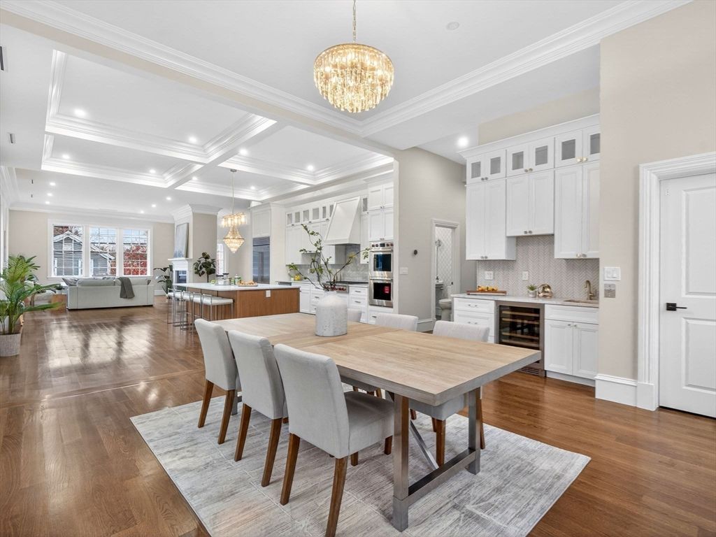 Chandelier, Dining room, Interior, Kitchen, Living room, Pendant Lights, Recessed Lighting, Stainless Steel Appliances, Wood Texture Flooring