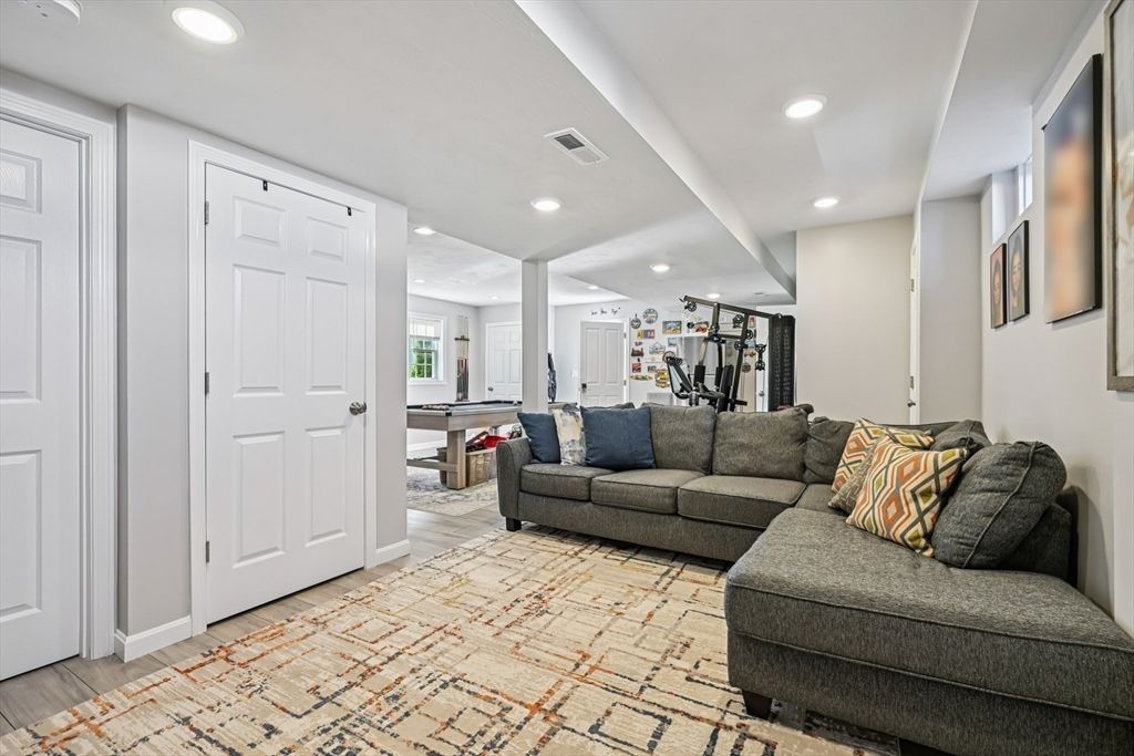 Fitness Equipment, Game Room, Interior, Living room, Recessed Lighting, Wood Texture Flooring