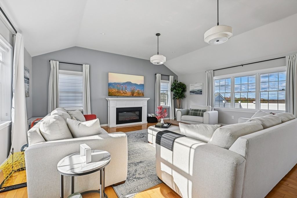 Fireplace, Interior, Living room, Pendant Lights, Recessed Lighting, Water, Wood Texture Flooring