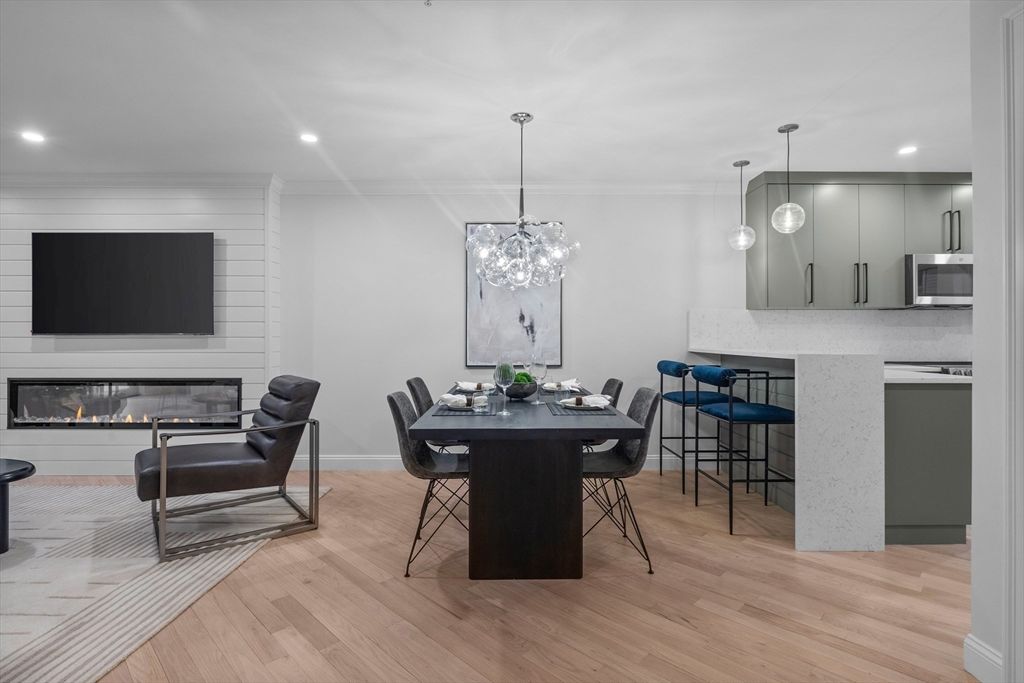 Dining room, Fireplace, Interior, Kitchen, Pendant Lights, Recessed Lighting, Stainless Steel Appliances, Wood Texture Flooring