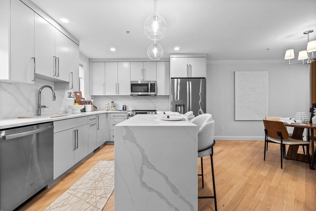 Dining room, Interior, Kitchen, Pendant Lights, Recessed Lighting, Stainless Steel Appliances, Wood Texture Flooring