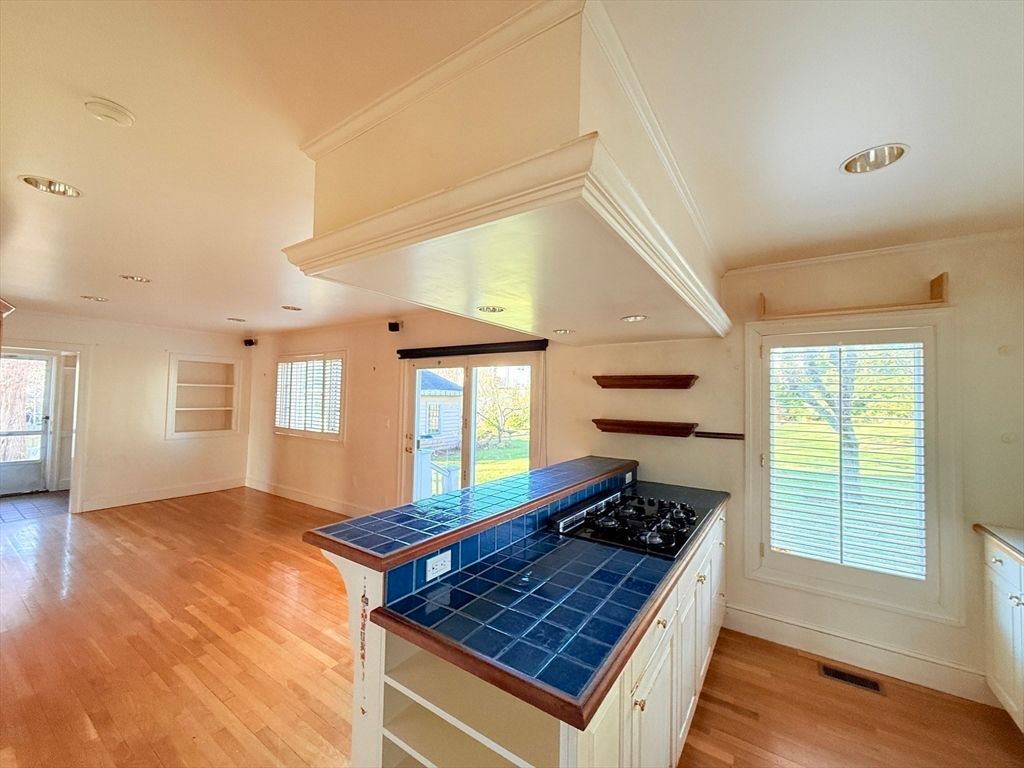 Interior, Kitchen, Recessed Lighting, Tile Countertops, Wood Texture Flooring