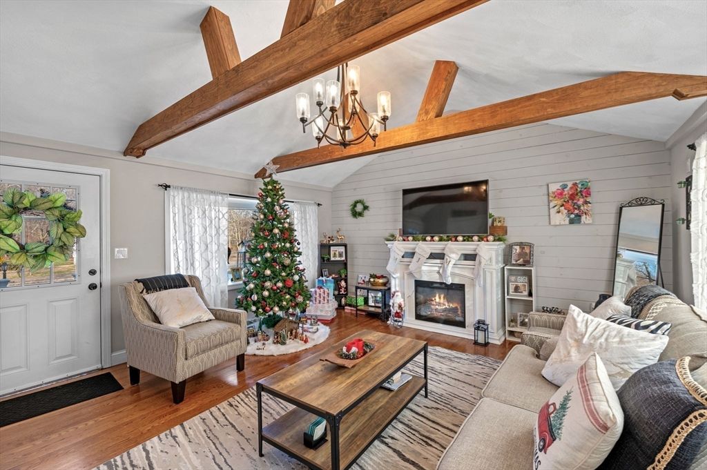 Chandelier, Fireplace, Interior, Living room, Stone Walls, Wooden Beams, Wood Texture Flooring