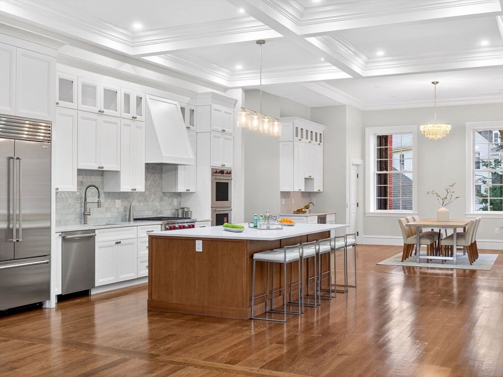 Chandelier, Dining room, Interior, Kitchen, Pendant Lights, Recessed Lighting, Stainless Steel Appliances, Wood Texture Flooring