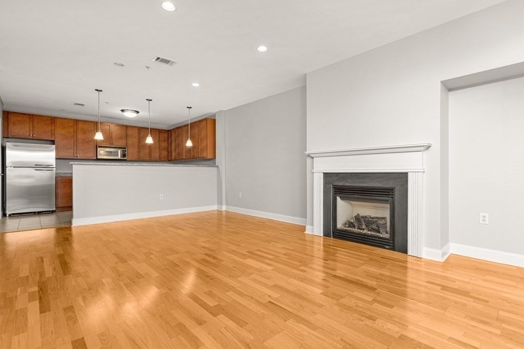 Empty room, Fireplace, Interior, Kitchen, Pendant Lights, Recessed Lighting, Wood Texture Flooring