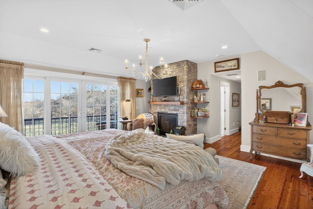 Bedroom, Chandelier, Fireplace, Interior, Recessed Lighting, Wood Texture Flooring