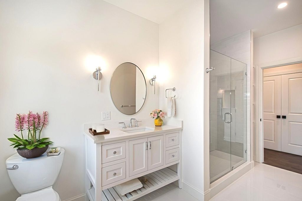 Bathroom, Dual Sink Vanities, Glass Shower, Interior, Recessed Lighting, Wood Texture Flooring