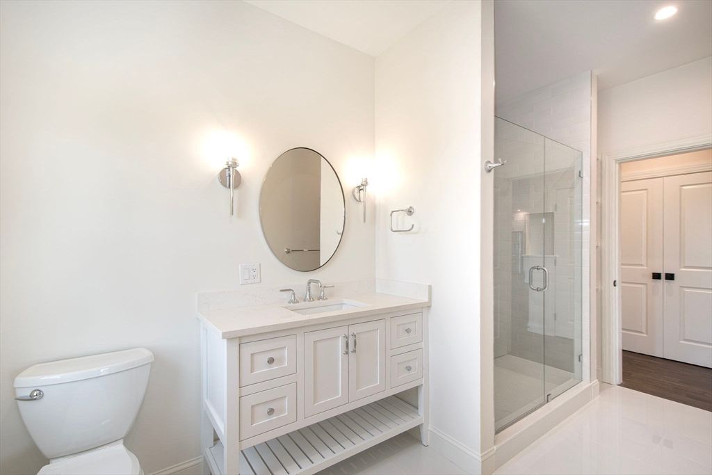 Bathroom, Dual Sink Vanities, Glass Shower, Interior, Recessed Lighting, Wood Texture Flooring
