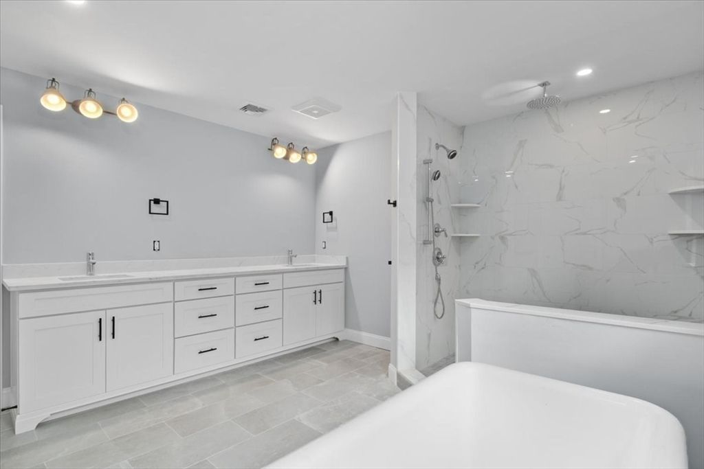 Bathroom, Dual Sink Vanities, Glass Shower, Interior, Marble Walls, Recessed Lighting