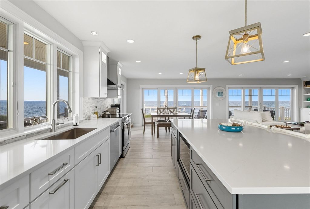 Dining room, Interior, Kitchen, Pendant Lights, Recessed Lighting, Stainless Steel Appliances, Water, Wood Texture Flooring