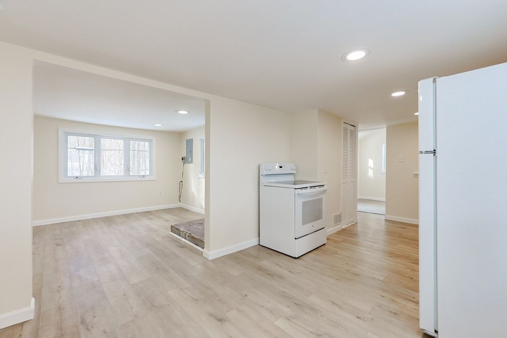 Empty room, Interior, Kitchen, Recessed Lighting, Washer, Wood Texture Flooring