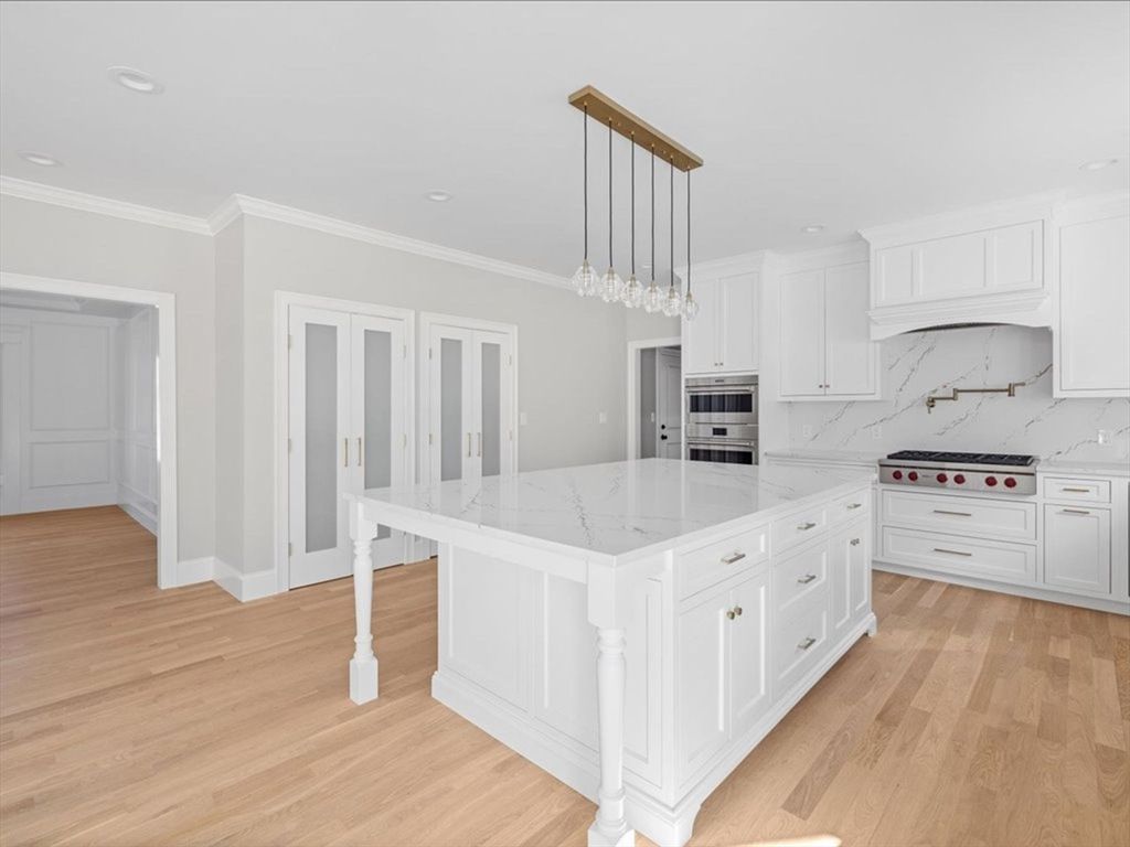 Interior, Kitchen, Marble Walls, Pendant Lights, Recessed Lighting, Stainless Steel Appliances, Wood Texture Flooring