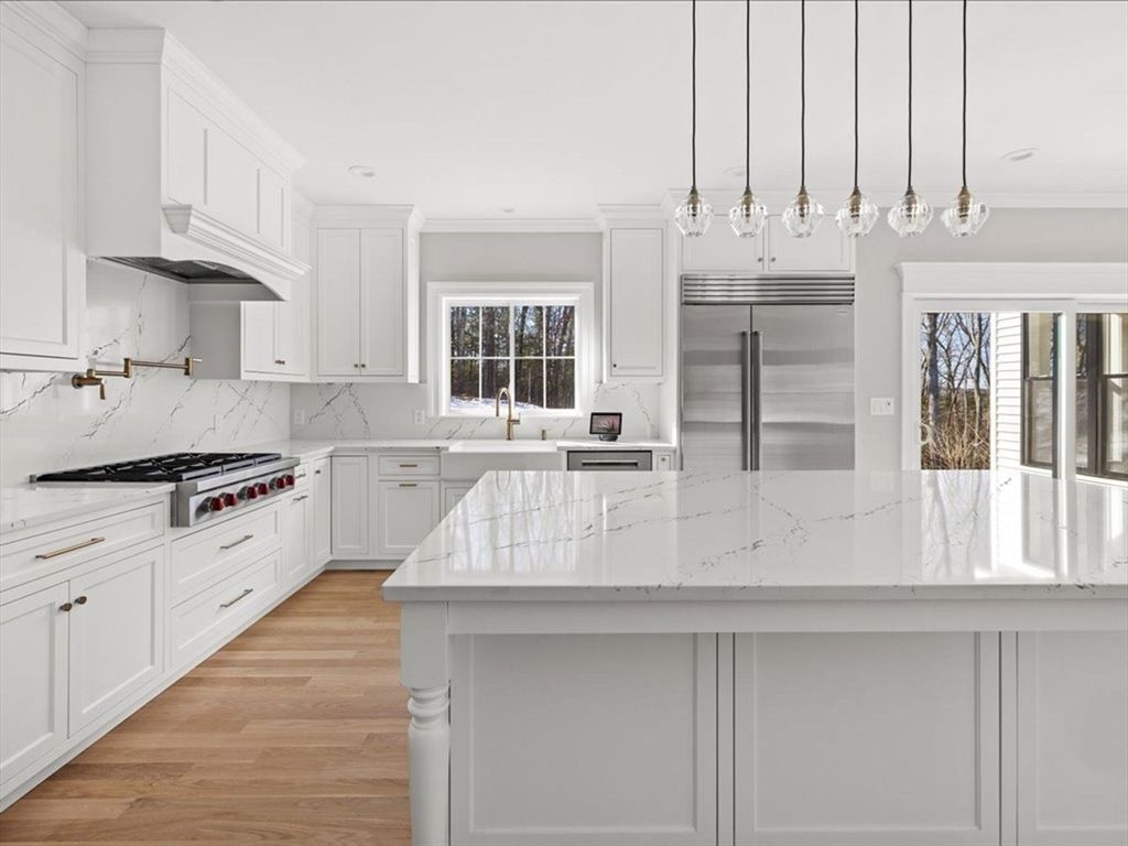 Interior, Kitchen, Marble Walls, Pendant Lights, Recessed Lighting, Stainless Steel Appliances, Wood Texture Flooring