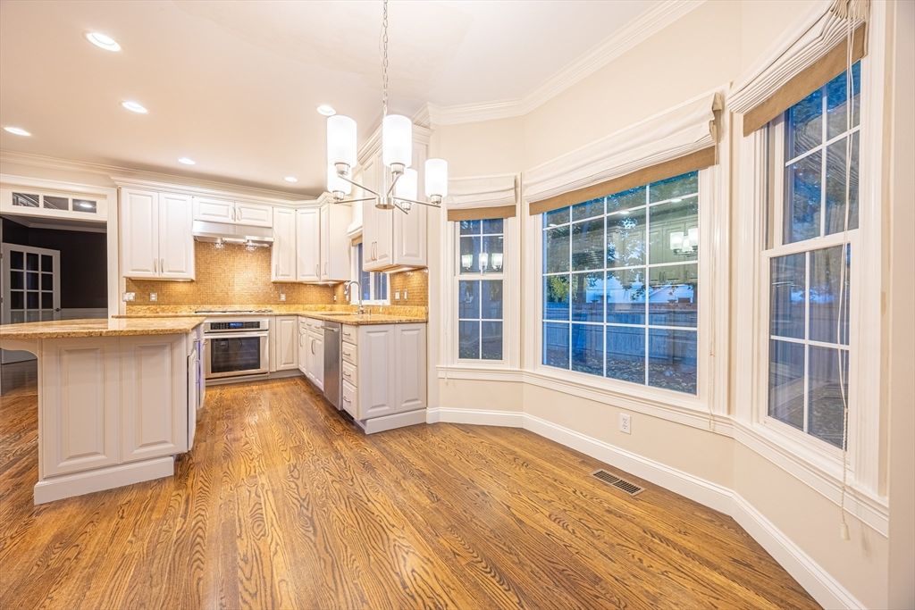 Chandelier, Interior, Kitchen, Pendant Lights, Recessed Lighting, Stainless Steel Appliances, Wood Texture Flooring