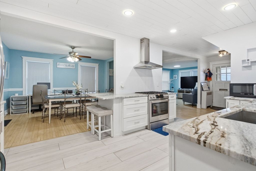 Dining room, Interior, Kitchen, Recessed Lighting, Stainless Steel Appliances, Wood Texture Flooring