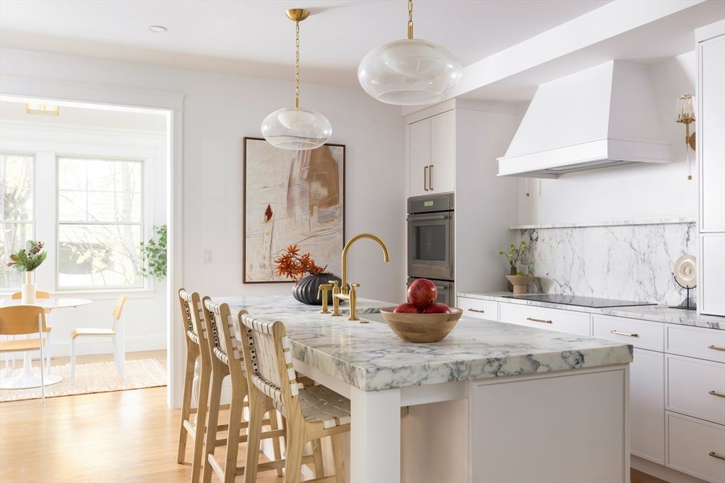 Dining room, Interior, Kitchen, Marble Walls, Pendant Lights, Recessed Lighting, Stainless Steel Appliances, Wood Texture Flooring