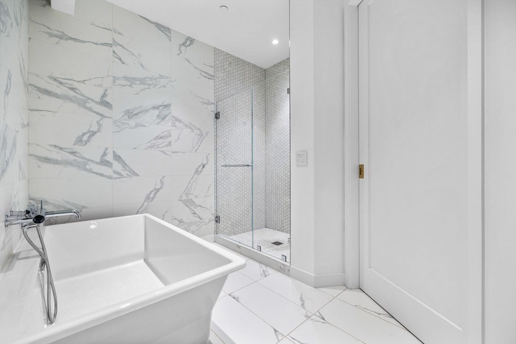 Bathroom, Free Standing Baths, Glass Shower, Interior, Marble, Marble Walls, Recessed Lighting