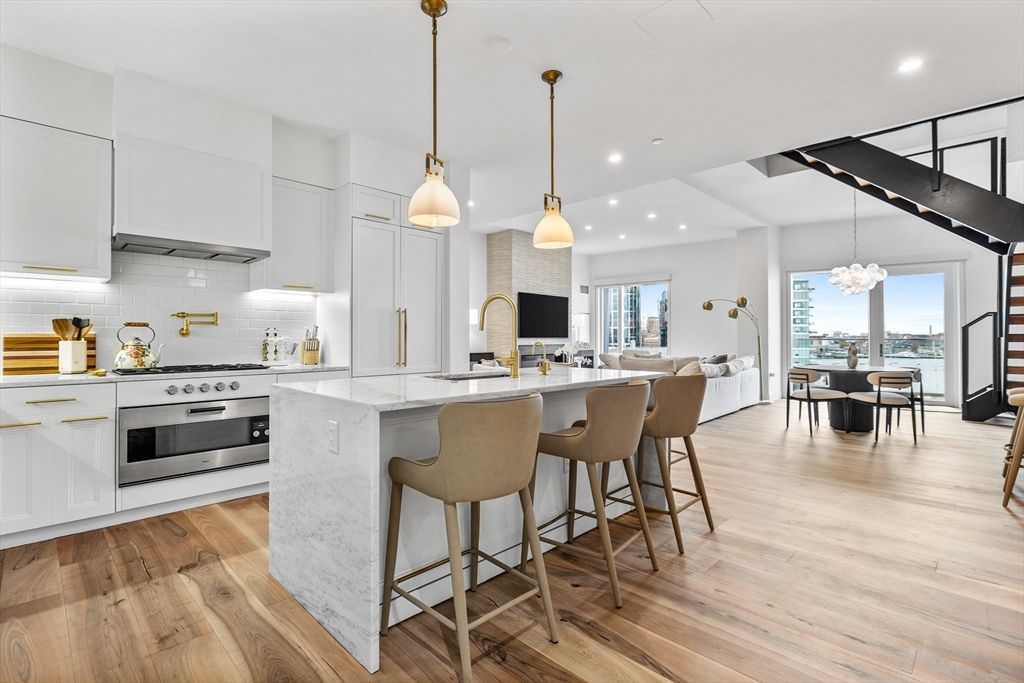 Dining room, Interior, Kitchen, Living room, Pendant Lights, Recessed Lighting, Stainless Steel Appliances, Water, Wood Texture Flooring