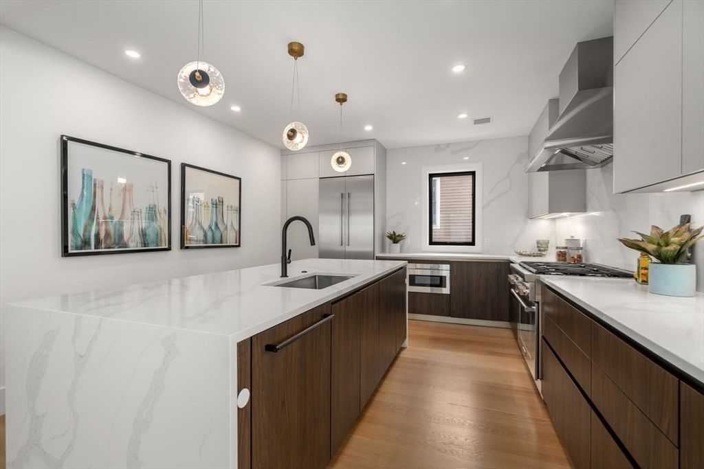 Interior, Kitchen, Marble Walls, Pendant Lights, Recessed Lighting, Stainless Steel Appliances, Wood Texture Flooring