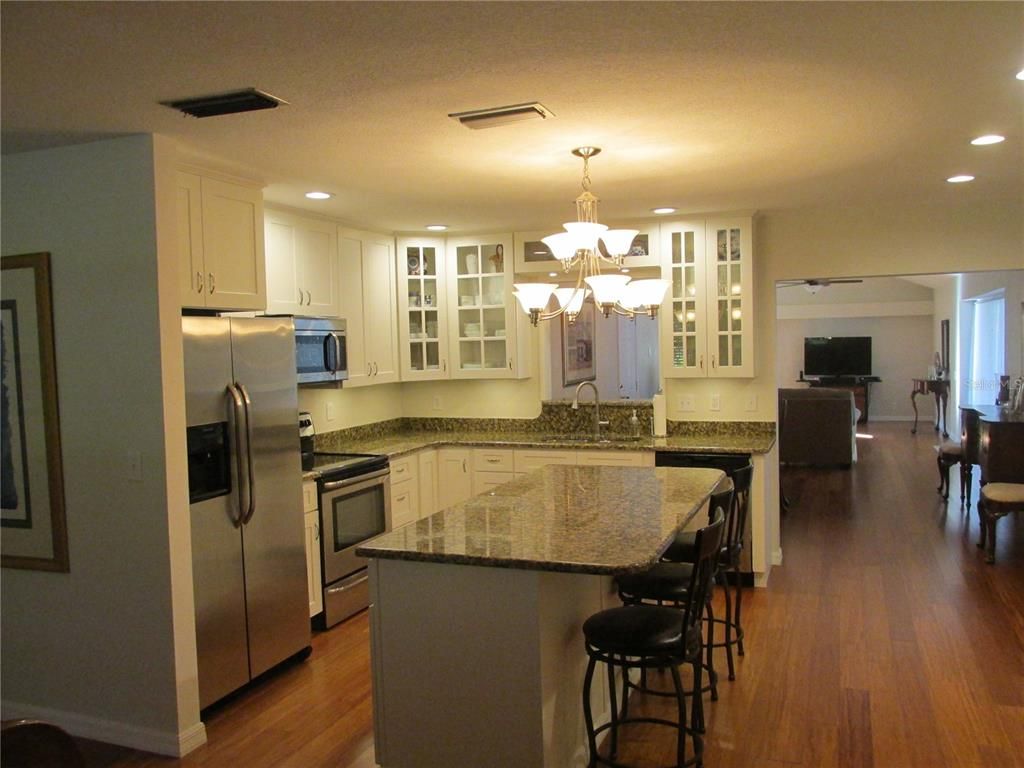 Chandelier, Interior, Kitchen, Recessed Lighting, Stainless Steel Appliances, Wood Texture Flooring